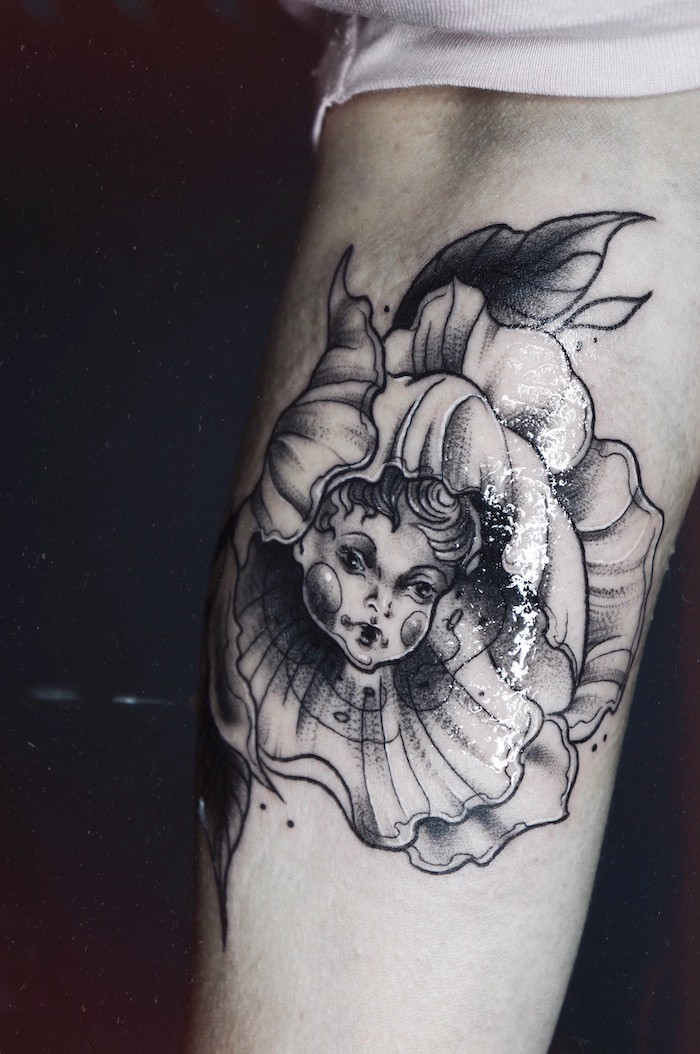 rose and spikes tattoo